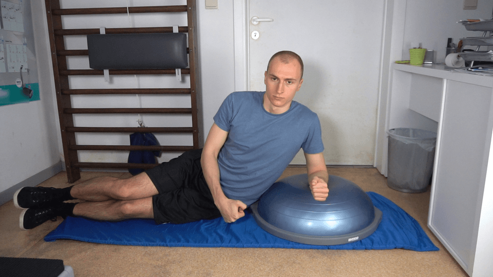 Man doing Bosu Side Plank Hip Dips