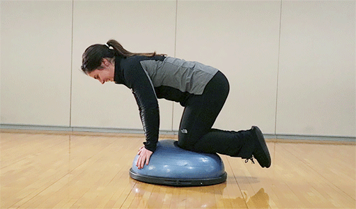 Woman doing BOSU Ball Bird-Dog