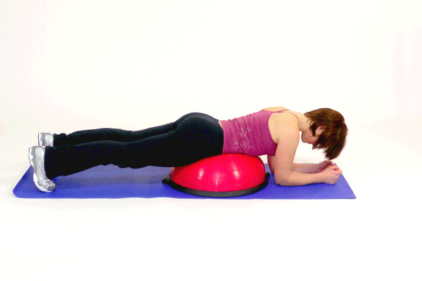 Woman doing BOSU Ball Superman Lifts