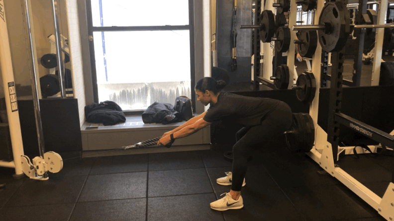Woman doing Cable Romanian Deadlift