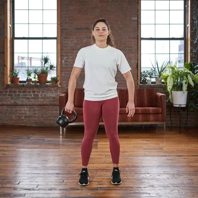 Woman doing Kettlebell Around-the-Worlds