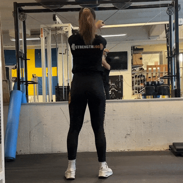 Woman doing Reverse-Grip Cable Crossover