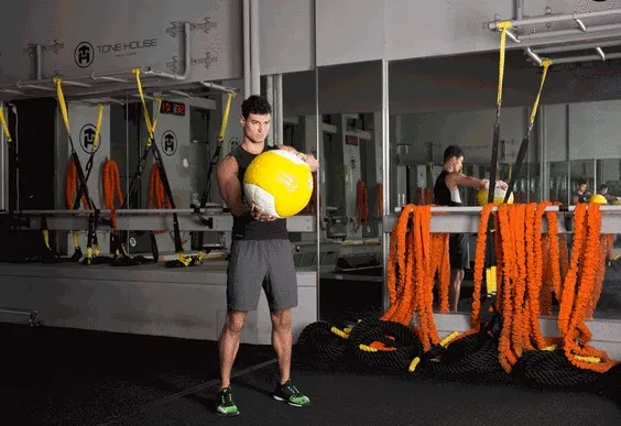 8. Man is doing Medicine Ball Halo